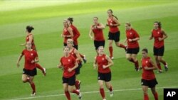 United States players warm up during a training session in preparation for the final match against Japan for the Women's Soccer World Cup Final in Frankfurt, Germany, July 16, 2011