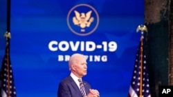 FILE - President-elect Joe Biden speaks at The Queen theater, in Wilmington, Del., Dec. 29, 2020.