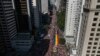 Participants carry a rainbow banner as thousands march in the annual Gay Pride Parade in Sao Paulo, June 2, 2024. 