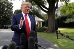 President Donald Trump talks to reporters before departing for a campaign rally in Cincinnati, on the South Lawn of the White House, Aug. 1, 2019.