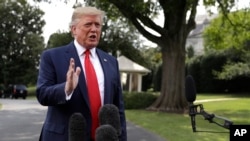 President Donald Trump talks to reporters before departing for a campaign rally in Cincinnati, on the South Lawn of the White House, Aug. 1, 2019.