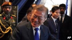South Korean President Moon Jae-in arrives for a luncheon in Dubai, United Arab Emirates, Tuesday, March 27, 2018. Moon on Tuesday attended an Emirati-Korean business forum at the Burj Khalifa, the world's tallest building, in Dubai as part of his tour of the UAE.
