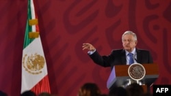 FILE - Mexican President Andres Manuel Lopez Obrador speaks during his daily morning press conference at the National Palace in Mexico City, Mexico, Nov. 21, 2019.