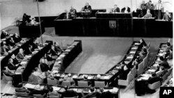 FILE - Egyptian President Anwar Sadat is seen at the speaker's podium during his address to lawmakers in Israel's parliament, in Jerusalem, Nov. 20, 1977.