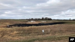 This Oct. 30, 2019 photo provided by the North Dakota Department of Environmental Quality shows affected land from a Keystone oil pipeline leak near Edinburg, North Dakota.