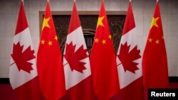 Picture of Canadian and Chinese flags