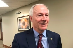 FILE - Arkansas Gov. Asa Hutchinson speaks to reporters in Little Rock, Arkansas, Jan. 13, 2020.