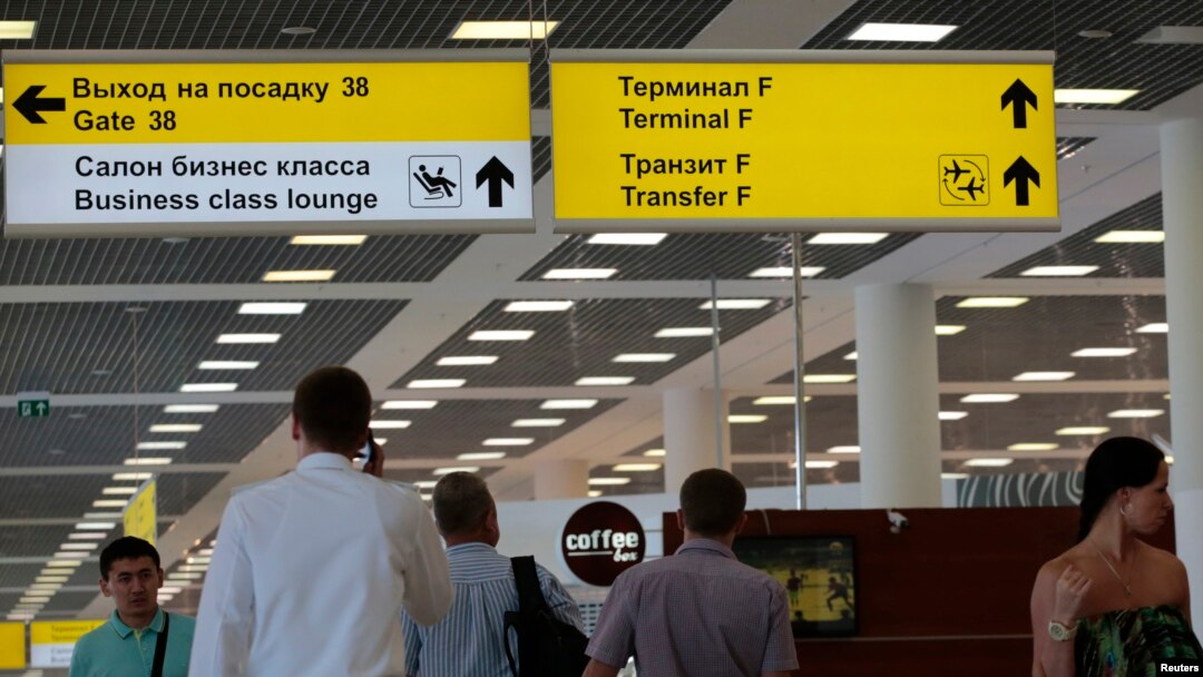 People walk inside the Moscow's Sheremetyevo airport, June 26, 2013. 