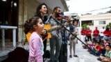 Displaced and refugee children attend an event where Lebanese singer Joy Fayad and musician Oliver Maalouf perform, amid the ongoing hostilities between Hezbollah and Israeli forces, in Dbayeh, Lebanon November 9, 2024. (REUTERS/Emilie Madi)