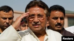 FILE - Pakistan's former President and head of the All Pakistan Muslim League (APML) political party Pervez Musharraf salutes as he arrives to unveil his party manifesto for the general election in Islamabad. 