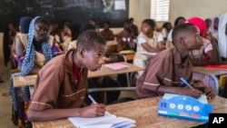 Mouhamed Sall, who is deaf, attends class at the Guinaw Rail Sud public high school in Pikine, Senegal, Monday, March 18, 2024. (AP Photo/Sylvain Cherkaoui)
