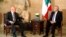 Lebanese Prime Minister Tammam Salam (L) talks with Lebanon's President Michel Suleiman at the presidential palace in Baabda, near Beirut, April 6, 2013. 