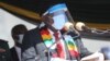 FILE - Zimbabwean President Emmerson Mnangagwa addresses mourners at the burial of Zimbabwean minister Perence Shiri, who died of Covid-19, during his burial in Harare, July, 31, 2020.