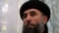 FILE - Gulbuddin Hekmatyar speaks to a reporter in 2002.
