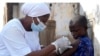 FILE - A health worker administers a cervical cancer vaccine HPV Gardasil to a girl on the street in Ibadan, Nigeria, on May 27, 2024. More than half of Africa's 54 nations – 28 – have introduced the vaccine in their immunization programs. 