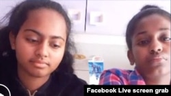 Teenage sisters Gloria, in black, and Kenean Kibrom, seen in this Facebook Live screen grab, have been comforting and supporting their parents, who both have been diagnosed with COVID-19. Now, the sisters have been tested at their home in Milan, Italy. 
