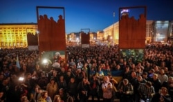 People attend a rally against the approval of the so-called Steinmeier Formula, in Kyiv, Ukraine, Oct. 2, 2019.