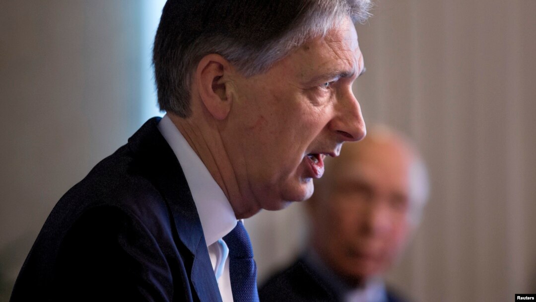 British Foreign Secretary Phillip Hammond, left speaks during a joint news conference with Pakistan Foreign Affairs Adviser Sartaj Aziz at the Foreign Ministry in Islamabad, Pakistan, March 8, 2016.
