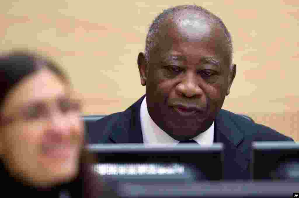 Former Ivory Coast President Laurent Gbagbo waits for the judge to arrive as he appears for the first time at the International Criminal Court to face charges of crimes against humanity in The Hague, Netherlands, Dec. 5, 2011. Gbagbo was extradited to the