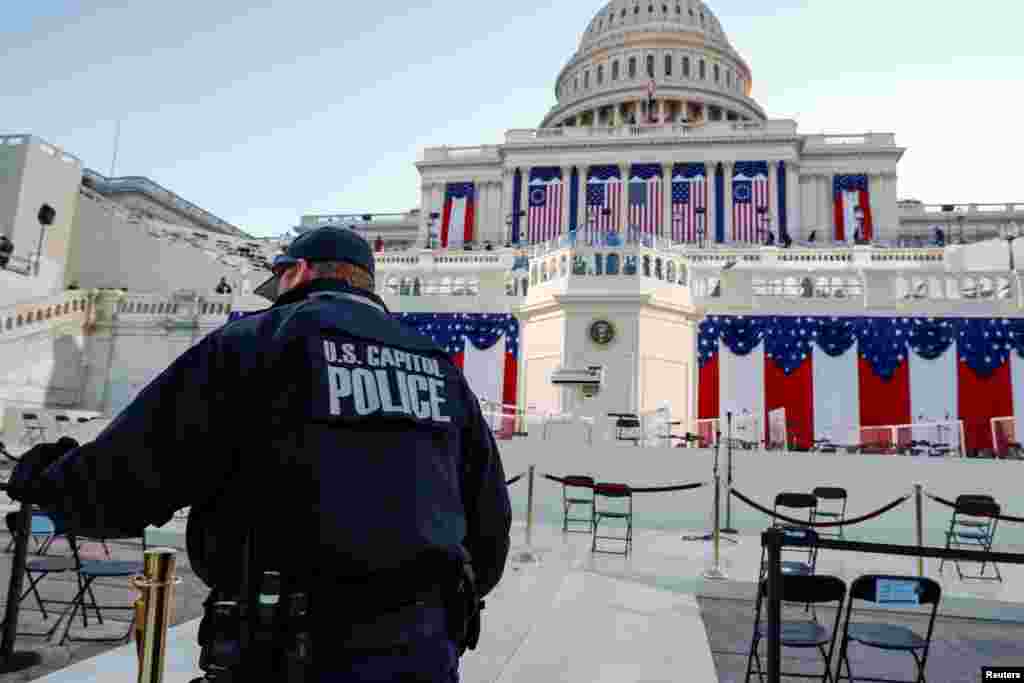 A U.S. Capitol police officer stands on the West Front of the Capitol before Joe Biden&#39;s presidential inauguration in Washington, Jan. 20, 2021. 
