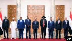 Leaders of Ethiopia, South Sudan, Chad, Eritrea, Central African Republic and Libya attending a summit about the Sudan conflict, pose for a group picture at the Presidential Palace in Cairo, Egypt, Thursday, July 13, 2023. Egypt.