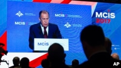 Russian Foreign Minister Sergei Lavrov is seen on a screen speaking at the Moscow Conference for International Security in Moscow, Russia, April 26, 2017.