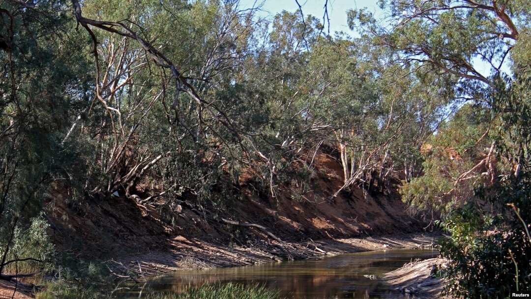 FILE - The drought-affected Darling River sits well below its banks at Pooncarie, a town in outback western New South Wales, Australia, April 25, 2019.
