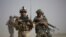 A US Marine and an Afghan soldier are seen on joint patrol in Helmand province, southern Afghanistan. (File)