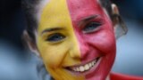 A soccer fan of Spain with her face painted, smiles during men's Group D football match against Honduras in the London 2012 Olympic Games at St James' Park in Newcastle July 29, 2012. 