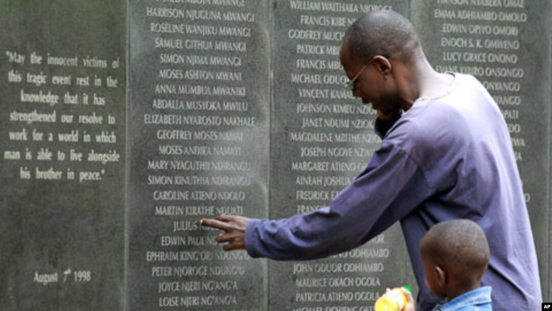 A survivor pays homage at the memorial wall with the names of 248 people killed in the 1998 bombing of the U.S.embassy are seen on the memorial wall in Nairobi. Al Qaeda leader Osama bin Laden was killed in a U.S. helicopter raid on a mansion near the Pak