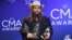 Singer/songwriter Chris Stapleton holds the awards for the male vocalist of the year, song of the year and single of the year at the 52nd annual CMA Awards at Bridgestone Arena, Nov. 14, 2018, in Nashville, Tenn. 