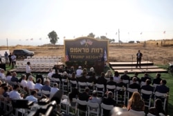 Israeli Prime Minister Benjamin Netanyahu speaks during a ceremony to unveil a sign for a new community named after U.S. President Donald Trump, in the Israeli-occupied Golan Heights, June 16, 2019.