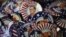 Republican presidential candidate and former Massachusetts Gov. Mitt Romney campaign buttons are displayed ahead of the Republican National Convention in Tampa, Fla., on Aug. 26, 2012. 