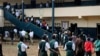 FILE - Liberian children line up to enter classrooms.