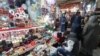 People shop at a market in Tehran on March 12, 2024, as they prepare for Nowruz, the Persian New Year.