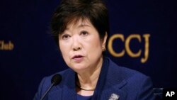 FILE - In this Feb. 18, 2019, file photo, Governor of Tokyo Yuriko Koike speaks during a press conference in Tokyo. Sapporo officials are thrilled with a proposal to move next year's Tokyo Olympic marathons to the northern Japanese city to avoid the summer heat in the city.