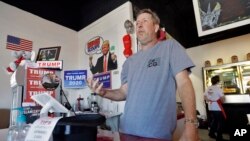 FILE - In this March 18, 2020 photo, Cliff Gephart, owner of Conservative Grounds coffee shop in Largo, Fla., speaks to a journalist at his shop. 