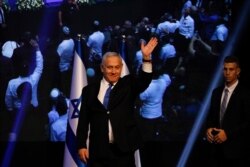 Israeli Prime Minister Benjamin Netanyahu addressees his supporters at party headquarters after elections in Tel Aviv, Israel, Sept. 18, 2019.