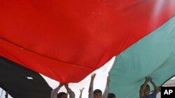 Palestinians rally in support of the Palestinian bid for statehood recognition in the United Nations, in the northern West Bank village of Al-Zababdeh, September 22, 2011.