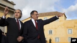 Portugal's Defense Minister Jose Pedro Aguiar-Branco, left, welcomes U.S. Defense Secretary Leon Panetta, to the Ministry of Defense, Forte de Sao Juliao da Barra, in Lisbon, Portugal, on January 15, 2013.