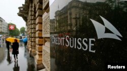 FILE - Swiss bank Credit Suisse's logo is seen in front of its headquarters in Zurich.