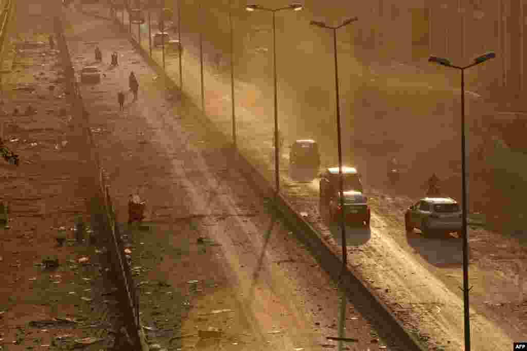 Debris is seen on a main road in Beirut at sunset following a twin explosion that shook the port of Lebanon&#39;s capital, Aug. 4, 2020. 