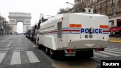 A French police water cannon vehicle is in place on the Champs-Elysees during the the 19th consecutive national protest Saturday of the "yellow vest" movement in Paris, March 23, 2019.