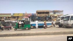 FILE: People load their belonging on a truck in Khartoum, Sudan, Tuesday, May 23, 2023. The U.N. migration agency IOM said Wednesday that the fighting between Sudan's military and a powerful paramilitary force had displaced more than a million people. 