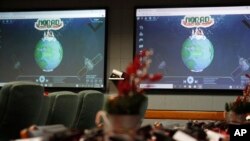 Monitors are illuminated in the NORAD Tracks Santa center at Peterson Air Force Base, Monday, Dec. 23, 2019, in Colorado Springs, Colo. (AP Photo/David Zalubowski)