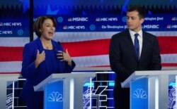 Democratic presidential candidate Senator Amy Klobuchar speaks as South Bend Mayor Pete Buttigieg listens during the fifth 2020 campaign debate at the Tyler Perry Studios in Atlanta, Nov. 20, 2019.