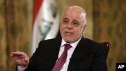 Iraq's Prime Minister Haider al-Abadi speaks during an interview with The Associated Press in Baghdad, Iraq, Sept. 16, 2017. 