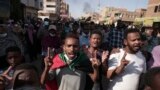 FILE: Sudanese protest Wednesday against the military coup that ousted government last month, in Khartoum, Sudan. More protests are planned for Sunday. Image taken 1.17.2021