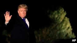 President Donald Trump waves as he leaves the White House in Washington, Jan. 24, 2018, enroute to Davos, Switzerland, to attend the World Economic Forum.