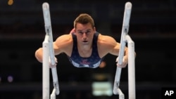 Sam Mikulak competes on the parallel bars during the men's U.S. Olympic Gymnastics Trials, June 26, 2021, in St. Louis.